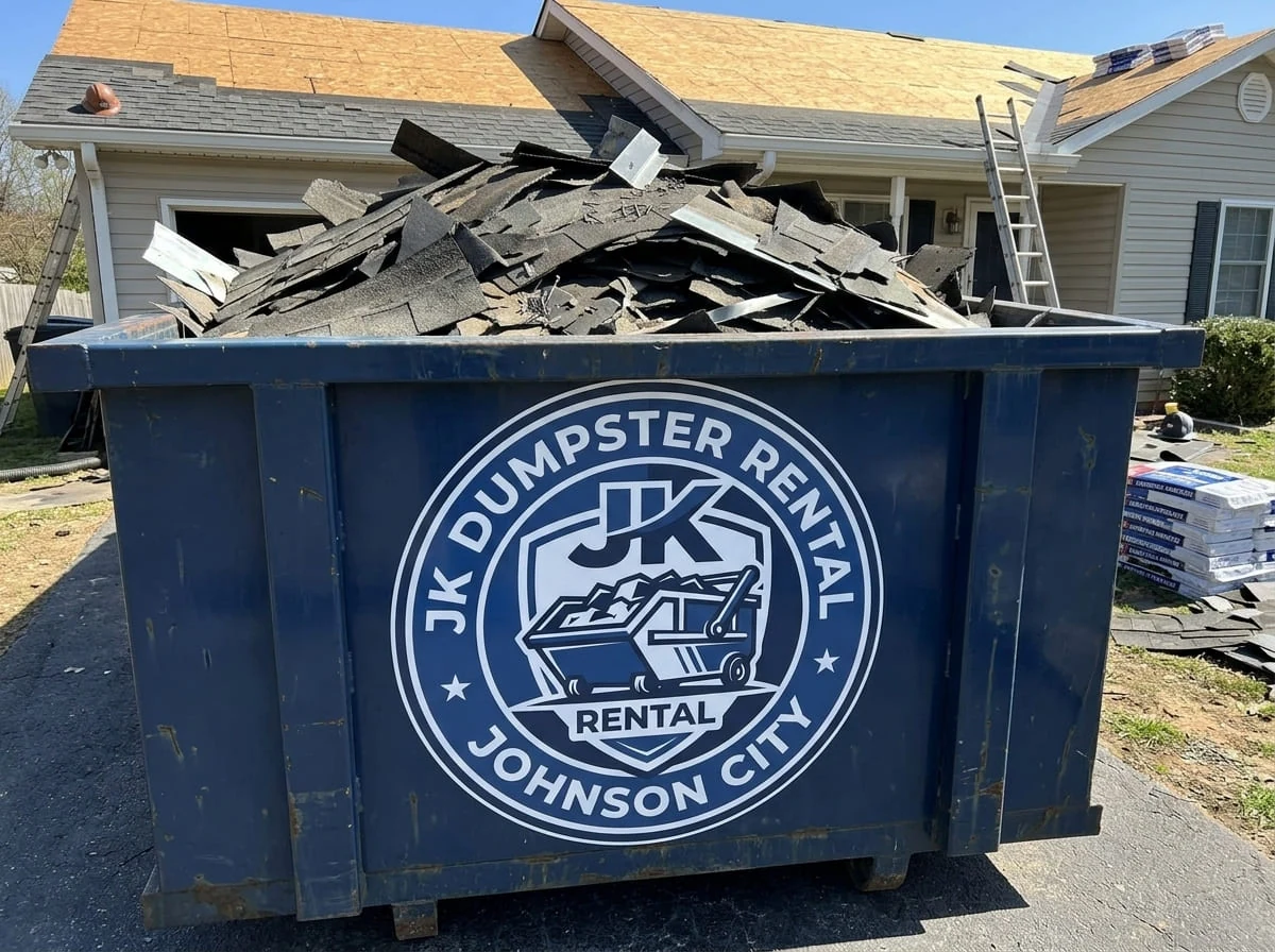 Dumpster loaded with roofing tear-off debris for proper disposal in Johnson City, TN